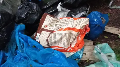 Wiltshire Council The bags of asbestos dumped in the forest