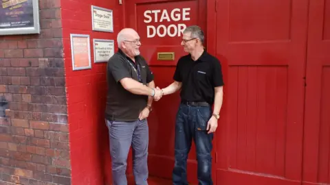 Tony Bell and Dave Shephard shaking hands