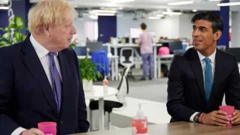 Getty Images Boris Johnson and with Rishi Sunak
