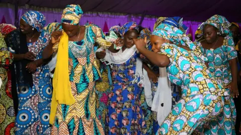 Reuters Image shows 'Chibok girls' dancing at a party in Abuja