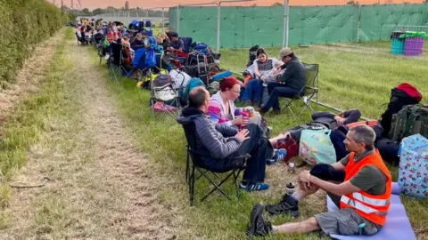 Queues have been growing outside the main entrance to the festival