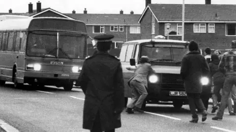 NCJ Archive/Mirrorpix/Getty Images Picketers attempt to stop a bus carrying working miners to Ellington colliery in Northumberland