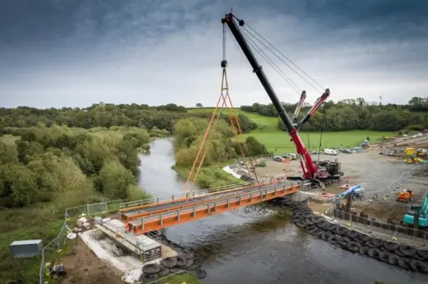 Cumberland Council The installation of the new 124 tonne temporary bridge that will provide access over the River Caldew to contractors