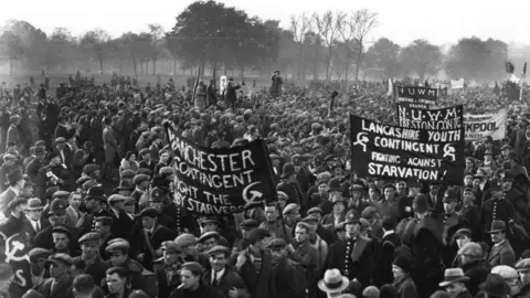 Getty Images A mass of Hunger Marchers arrive in Hyde Park from all over Britain in protest against poverty and unemployment. November 1932: