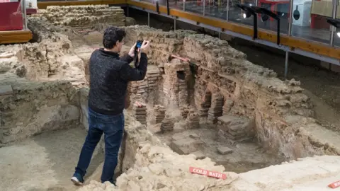 Kris Lockyear Heritage photographer, Antonio Reis, taking photographs of Welwyn Roman Baths