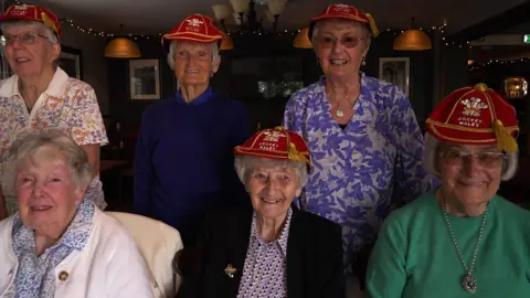 Former Wales hockey players with their caps