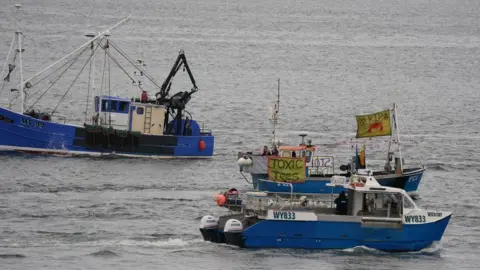 PA Media Boats on the water flying banners