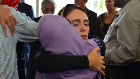 EPA Jacinda Ardern hugs woman in Christchurch