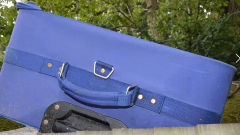 PA Media Blue suitcase