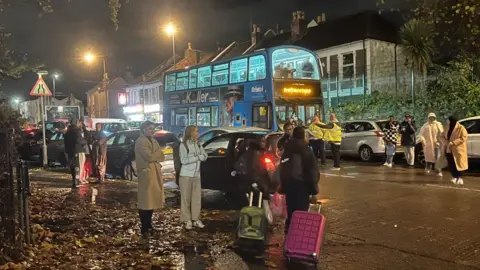 A queue of residents waiting to get bus