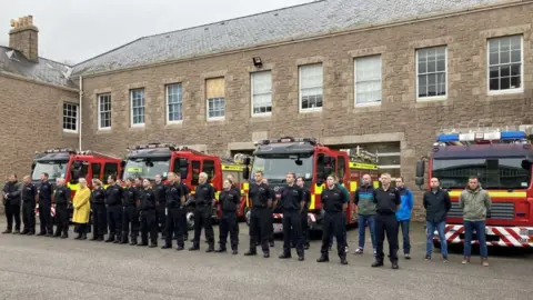 BBC A minute's silence at Jersey Fire and Rescue headquarters