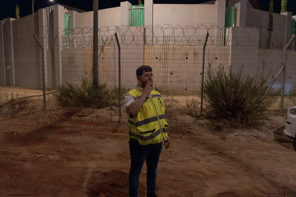 Frankel, breaking to smoke outside the walls of the army base where the bodies are processed