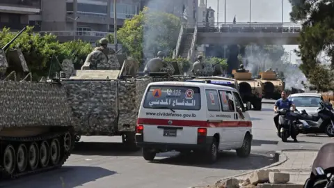 AFP Lebanese army armoured personnel carriers and ambulances near the Palace of Justice in Beirut, Lebanon (14 October 2021)