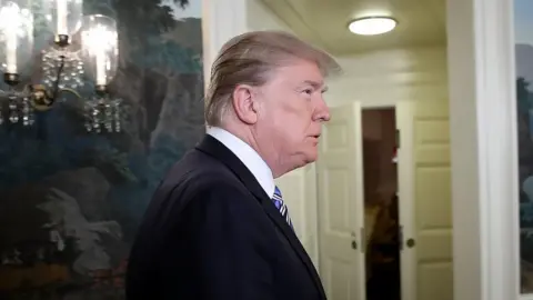 Getty Images Donald Trump prepares to give remarks on the Parkland shooting.