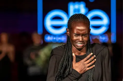 EPA Majda John Peter crying tears of joy.