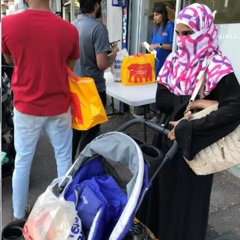 Rahemunissa Shaik with groceries