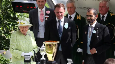 PA Media Queen Elizabeth II and Sheikh Mohammed at Royal Ascot in June 2019