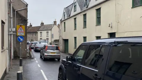 John Wimperis Congestion in Banwell as A-road traffic goes through 'the narrows'