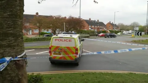 Police cordon and van