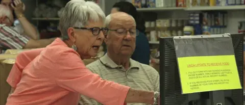 BBC Sally Frogge at the food pantry, Jamestown