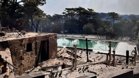 Sira Thierij/BBC The swimming pool at a camping site of Dune du Pilat destroyed by a major fire near La Teste-de-Buch forest