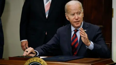 Getty Images US President Joe Biden signs legislation to avoid a rail strike