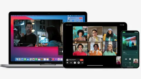 Apple A laptop, iPad and iPhone show Facetime calls, with a movie playing on the laptop and music playing on the iPAd