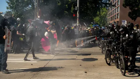 Getty Images Police use pepper spray against protesters in Seattle