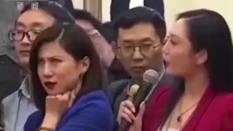 Eyeroll by a female journalist captured on a video circulating on Weibo