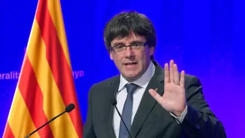 AFP/Getty Images Catalan President Carles Puigdemont speaks at a news conference in Barcelona. Photo: 2 October 2017