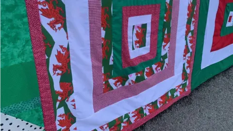 a close-up of the patchwork artwork on Llangollen's bridge