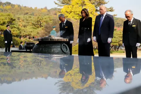 Reuters US President Donald Trump and first lady Melania attend a wreath-laying ceremony at the National Cemetery in Seoul, South Korea, 8 November 2017.