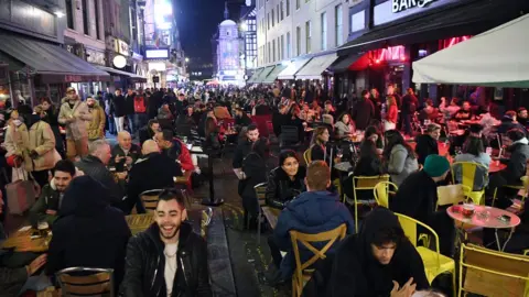 EPA People enjoy their last night out in Soho before a four-week national lockdown