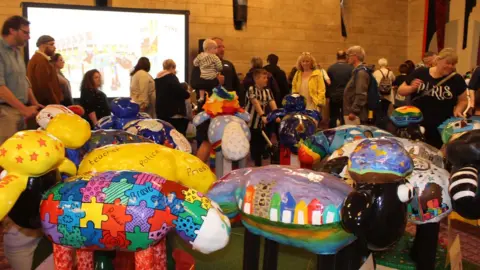 St Oswald's Hospice Visitors among the Shaun the Sheep models