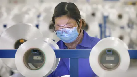 Chinese employee working in factory