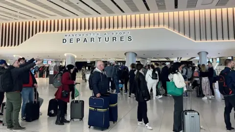 Reuters Queues at Manchester Airport