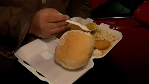 Michael Nagasaka / BBC A tray containing a rice meal