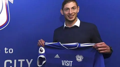 AFP Sala posing with a Cardiff City shirt on 20 January
