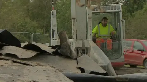 Plastic sheeting being removed from River Keele