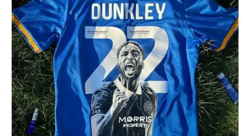 Mark Fielden A Shrewsbury shirt painted with the captain's image