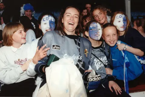 Alamy Millwall Lionesses goalkeeper Pauline Cope with fans after beating Wembley at the New Den