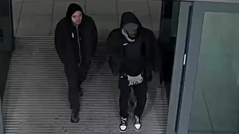 Met Police CCTV image of two men the Met is trying to identify