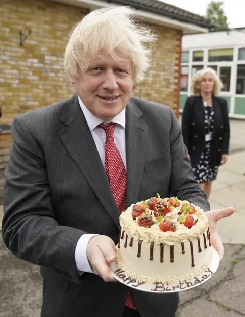 Andrew Parsons / No 10 Downing Street Boris Johnson holding birthday cake on 19 June 2020