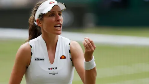 Getty Images Johanna Konta reacts after hitting a shot out against Czech Republic's Barbora Strycova during their women's singles quarter-final match on day eight of the 2019 Wimbledon Championships