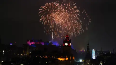 PA Media Fireworks at Edinburgh Castle to mark New Year 2023