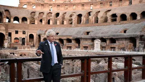 Getty Images British Prime Minister Boris Johnson visits the Colosseum during the G20 summit