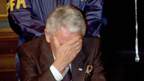 AFP The former director of investigations of the Buenos Aires police, Miguel Etchecolatz, attends the opening hearing of his trial on abduction, torture and murder charges for his role during the 1976-1983 military dictatorship, the first such trial ever in Argentina, 20 June 2006 in La Plata