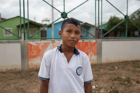 Antón Alexander López Marcelo Jesus Gouriyú, a 13-year-old Venezuelan pupil who attends school in Colombia