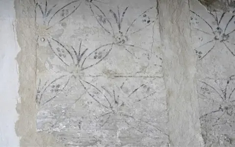 Owen Humphreys/PA Flower motif uncovered at Lindisfarne Castle