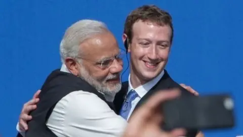 AFP Modi hugging Mark Zuckerberg